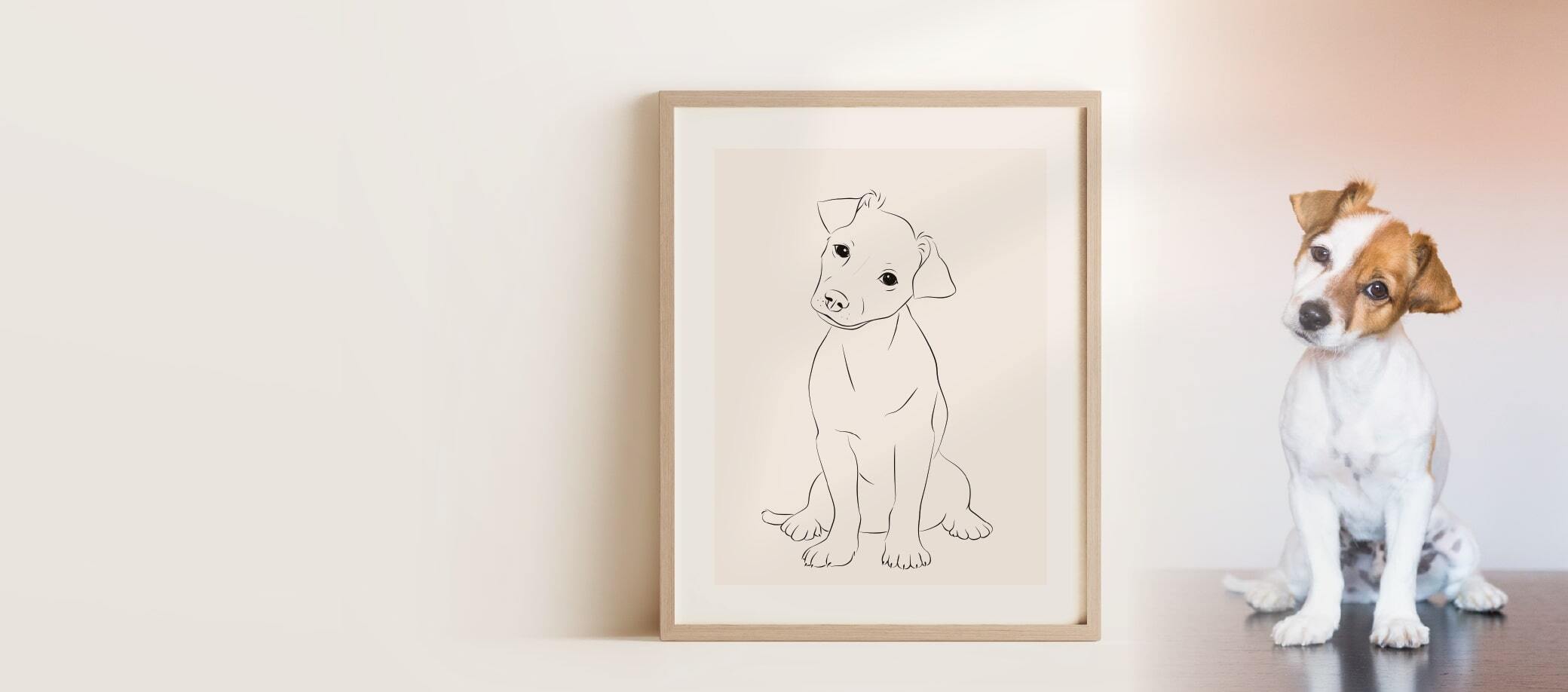 Een Miroar Line Art afbeelding van een jonge Jack Russell, die zich naast de tekening bevindt in een eikenhouten lijst