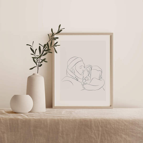 Line Art tekening van een koppel, tekening staat in lijst op tafel naast een plant